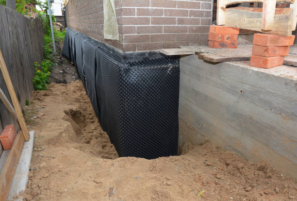 Happy homeowners after waterproofing job in Saint Marys City